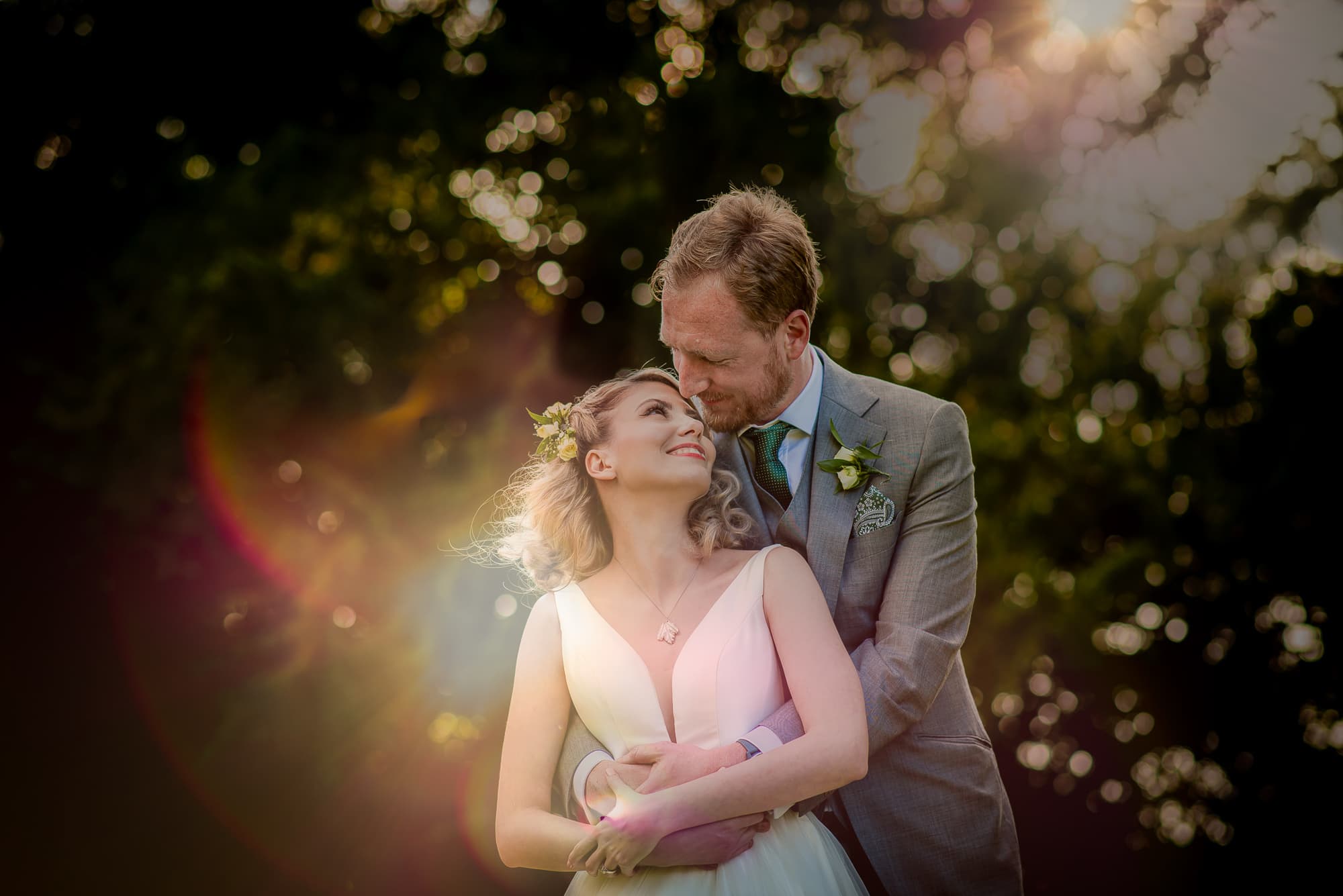 A Golden hour portrait of the bride and groom during wedding at Holmewood Hall Wedding Venue in Cambridgeshire