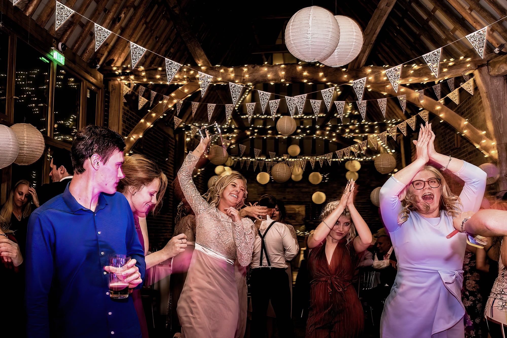 Wedding Guests on the dance floor at The Thatch Barn Yelling
