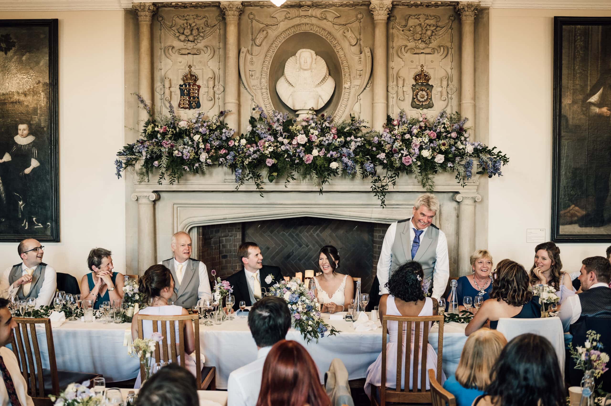 Wedding guests enjoying speeches at Madingley Hall Wedding in Cambridge