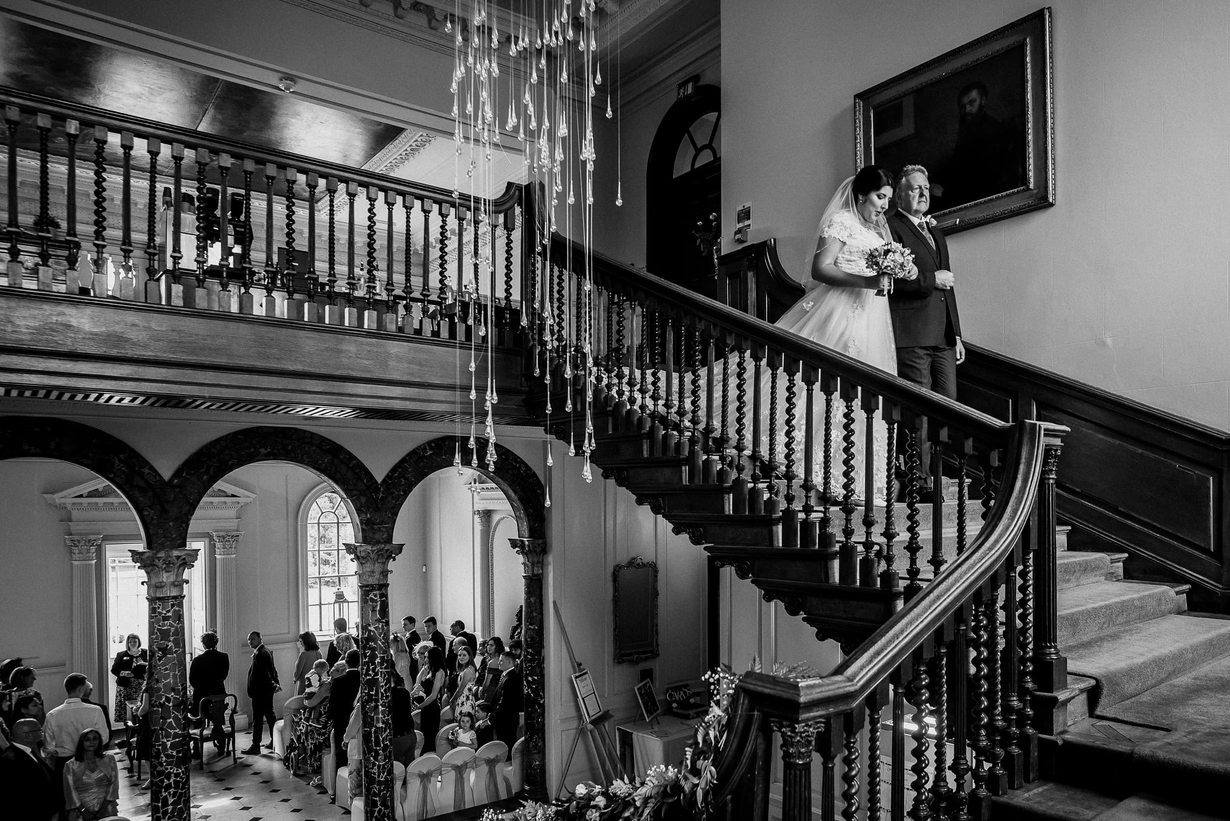 Bride on stairs at Cambridgeshire Wedding