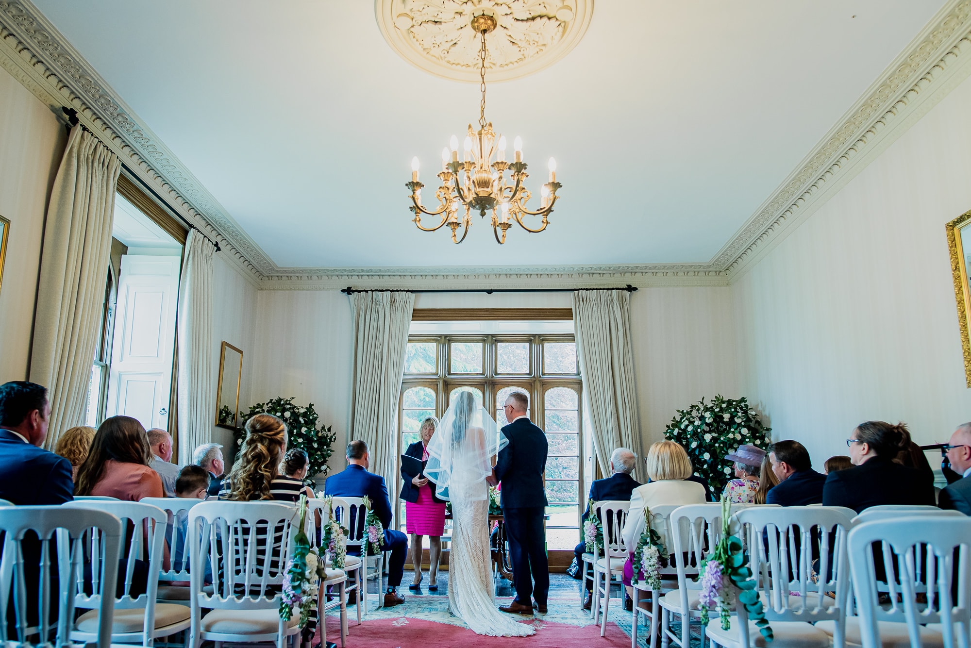 An indoor wedding ceremony at Hockwold Hall