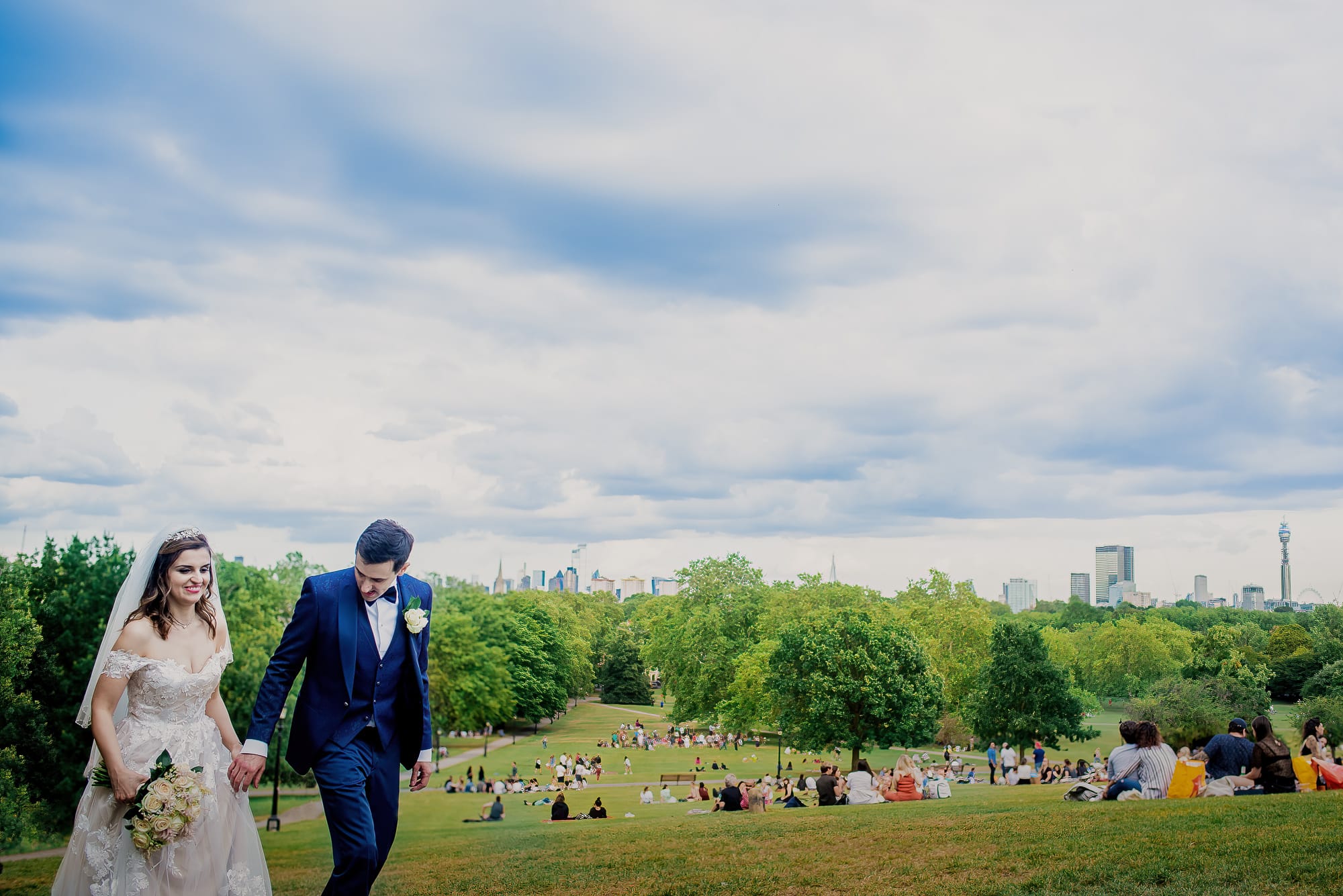 Bride and Groom on Primrose Hill with London Skyline behind