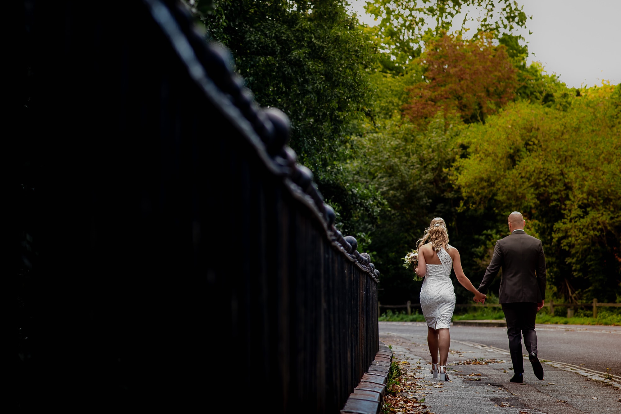 Bride & Groom having a walk after their small and intimate wedding in  Cambridge